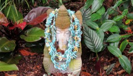 Ganesha blessed with leis  