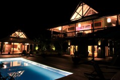 House, master suite and pool at night          